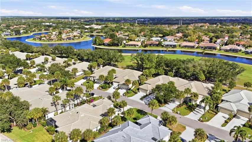 Aerial perspective of suburban area with a nearby body of water