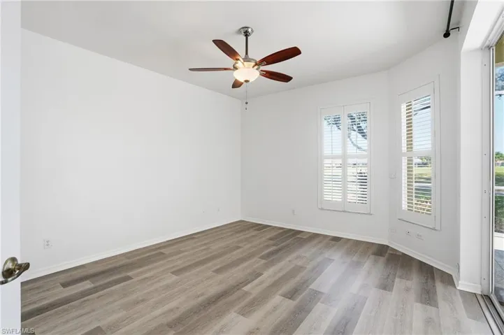 Spare room with light wood-style flooring and a ceiling fan