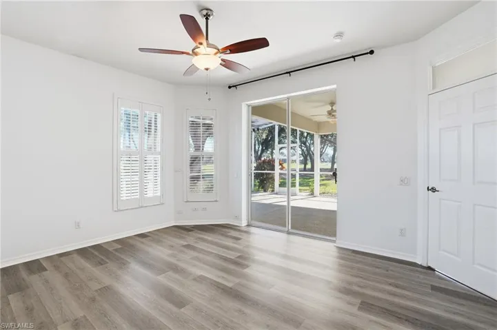 Unfurnished room with plenty of natural light and wood finished floors