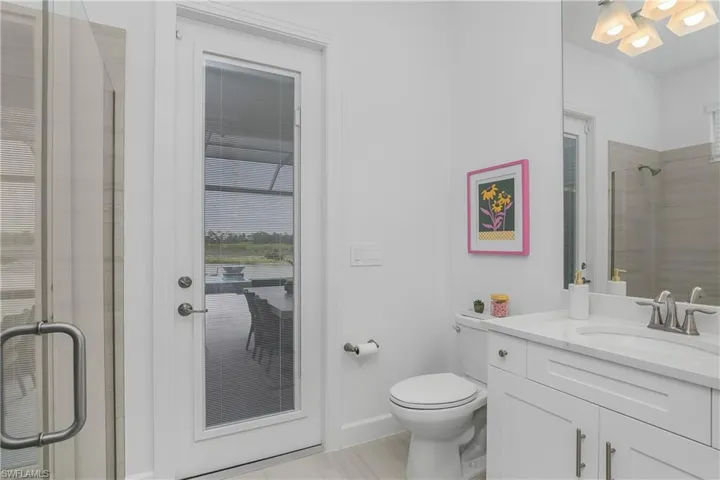 Bathroom with a stall shower and vanity