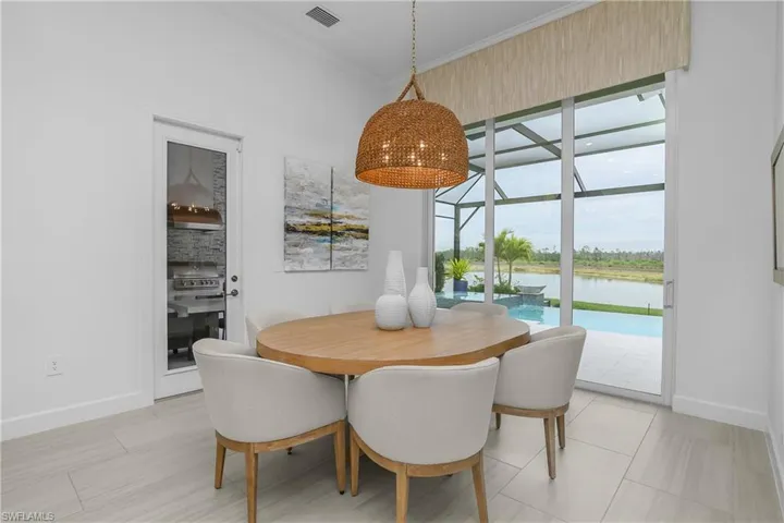 Dining room with baseboards and crown molding