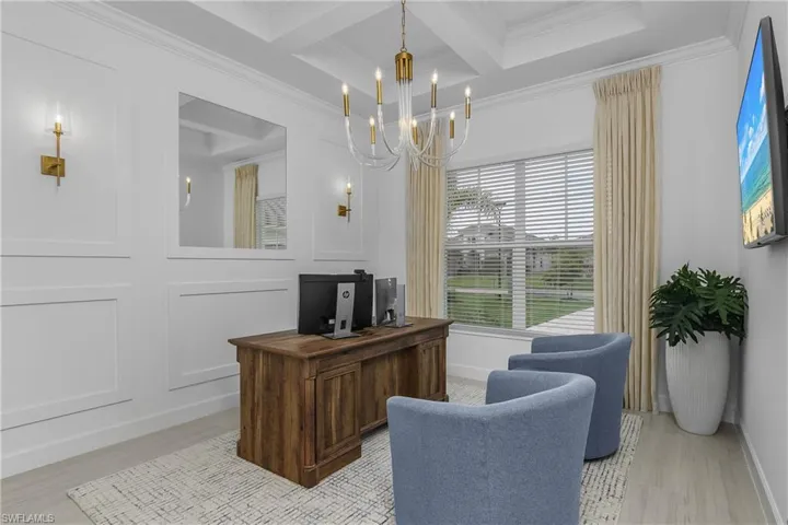 Office area featuring hanging lights, coffered ceiling, and crown molding
