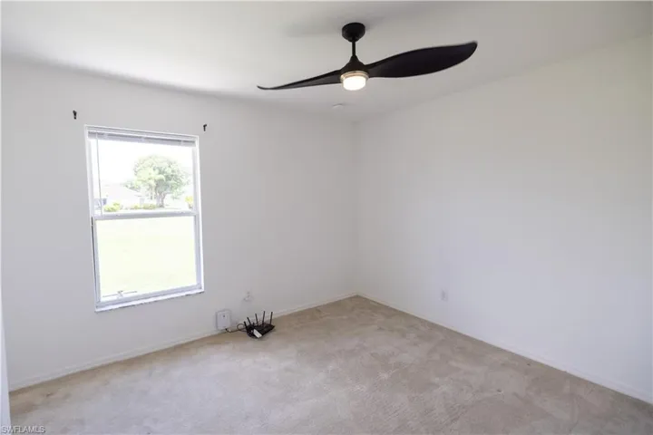Bedroom 3 view from doorway, including ceiling fan