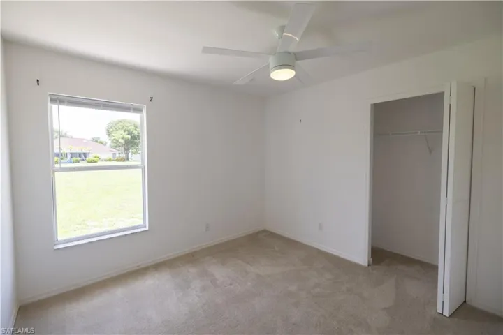 Bedroom 2 with closet, and a ceiling fan