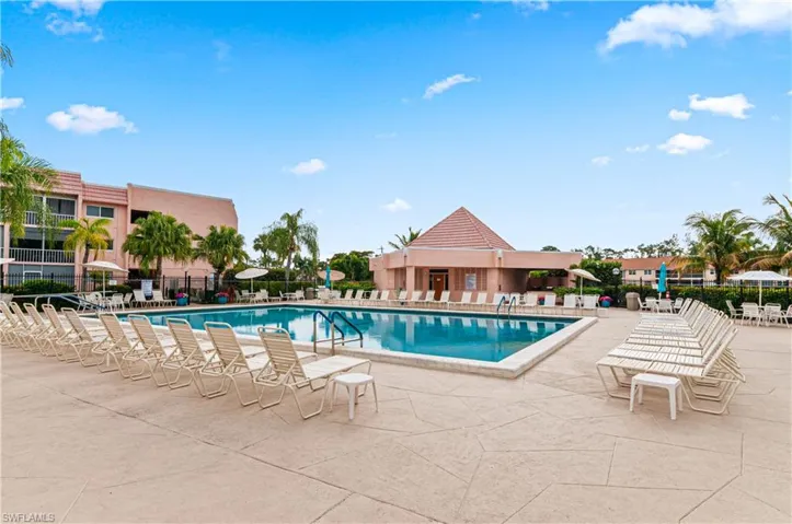 Community pool with a patio