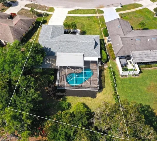 Aerial view of large pool and .33 acre lot
