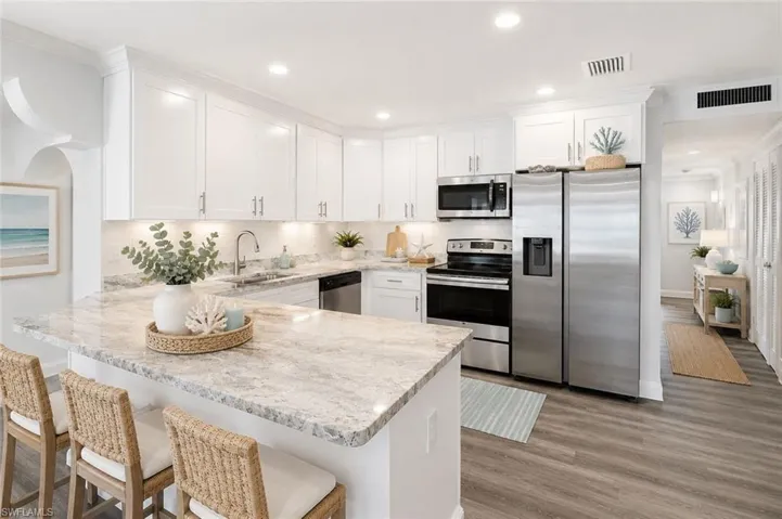 Welcome Home - Virtually Staged Kitchen with Stainless Steel Appliances and Beautiful Countertops