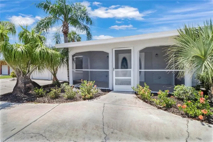 Front of House with screened-in front porch
