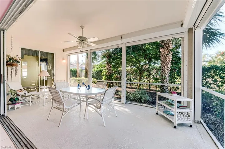 Sunroom featuring healthy amount of natural light, ceiling fan, and outdoor dining area