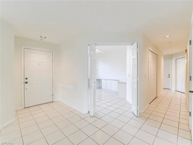 Foyer featuring recessed lighting and light tile patterned floors