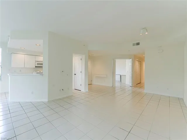 Spare room with light tile patterned floors and recessed lighting