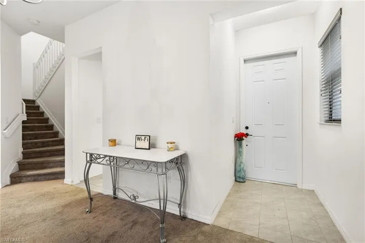 View of carpeted foyer entrance