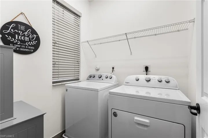 Laundry room featuring washing machine and clothes dryer