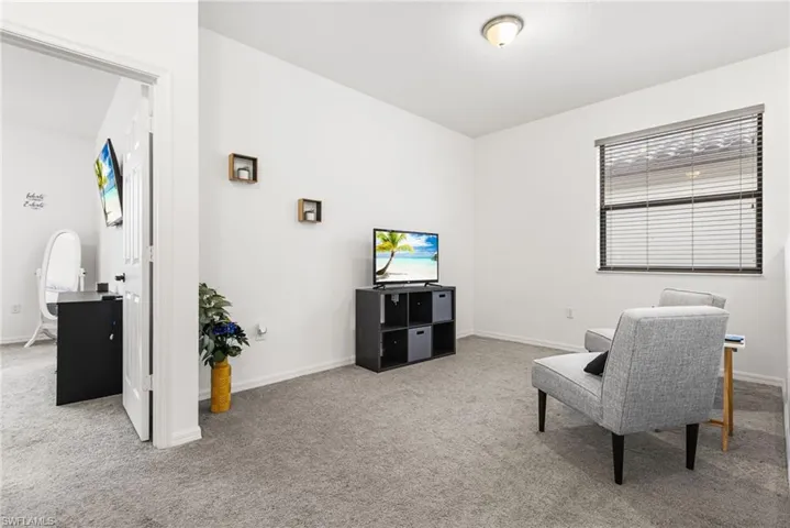 Living area featuring carpet