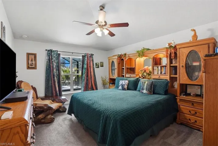 Bedroom with carpet and a ceiling fan