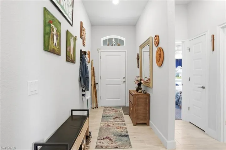 Entryway featuring wood finished floors and baseboards