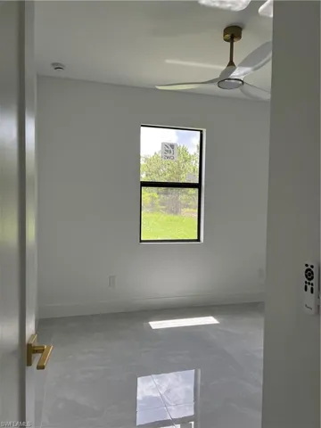 Unfurnished room featuring baseboards
