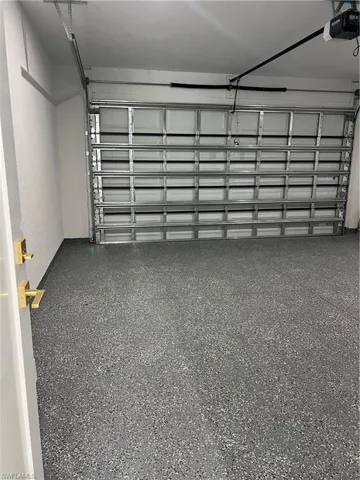 Garage featuring a garage door opener