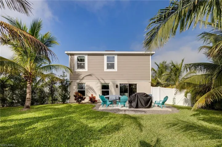 Back of property featuring a patio, a fenced backyard, and siding