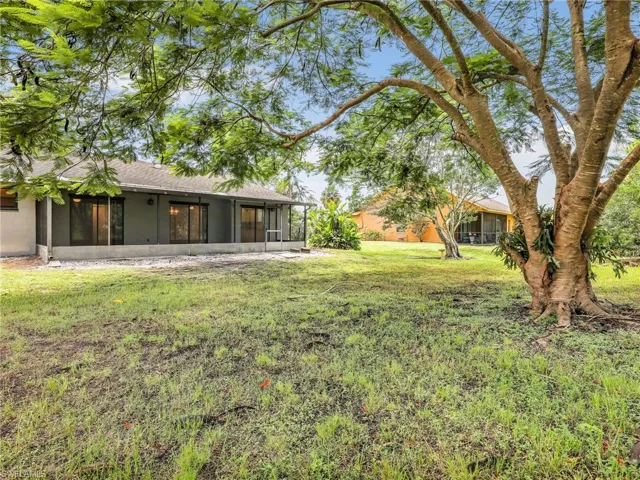 View of yard with a sunroom