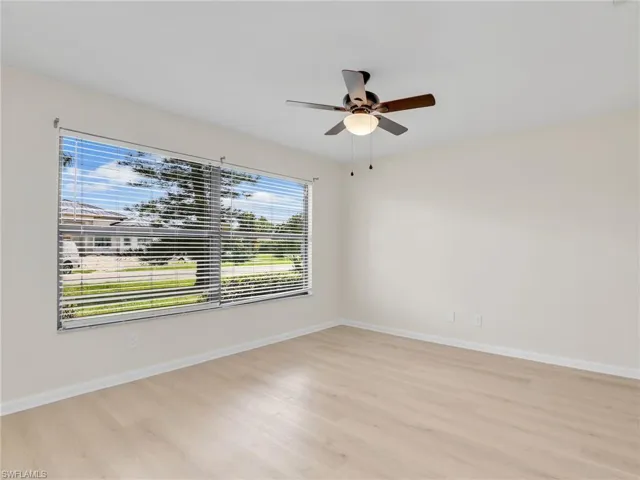 Unfurnished room featuring light hardwood / wood-style floors and ceiling fan