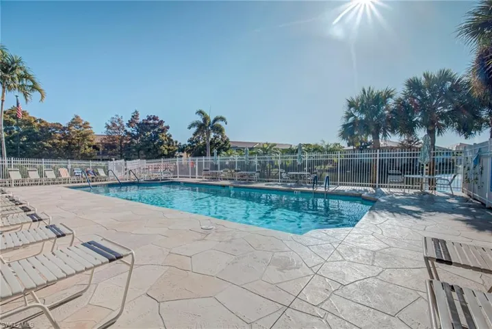 Community pool featuring a patio area