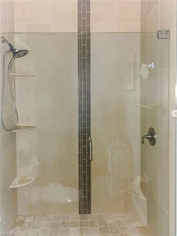 Full bathroom with a stall shower