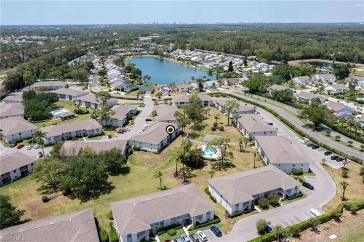 Aerial view featuring a water view and a residential view
