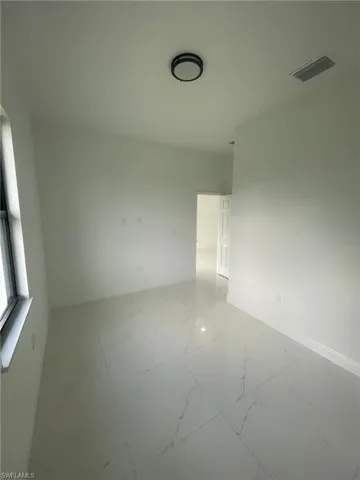 Unfurnished room with tile patterned floors