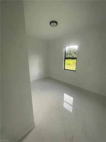 View of tiled spare room