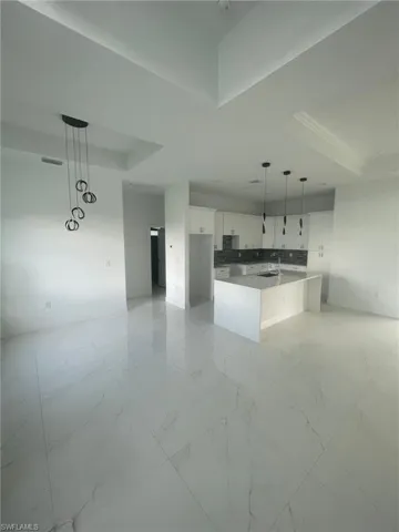 Unfurnished living room with light tile patterned flooring