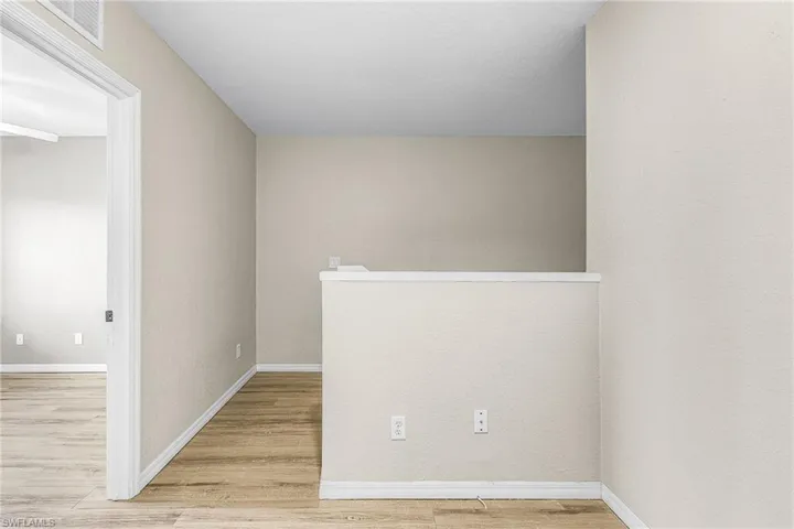 Unfurnished room featuring light wood-type flooring