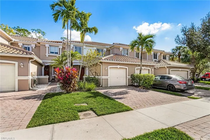 Mediterranean / spanish home with stucco siding, decorative driveway, and a tiled roof