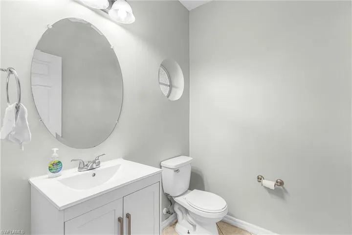 Bathroom with vanity and light tile patterned floors
