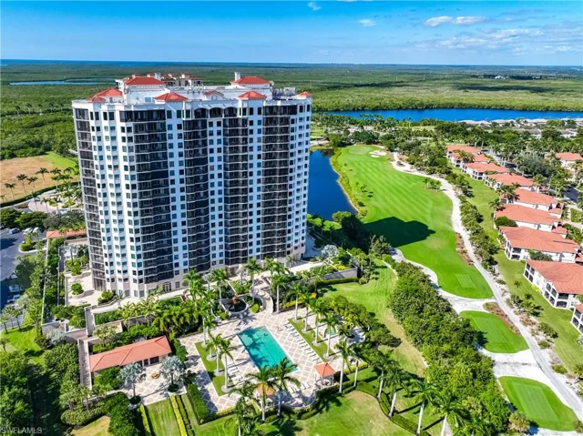 Aerial view of apartment complex / building and a golf club