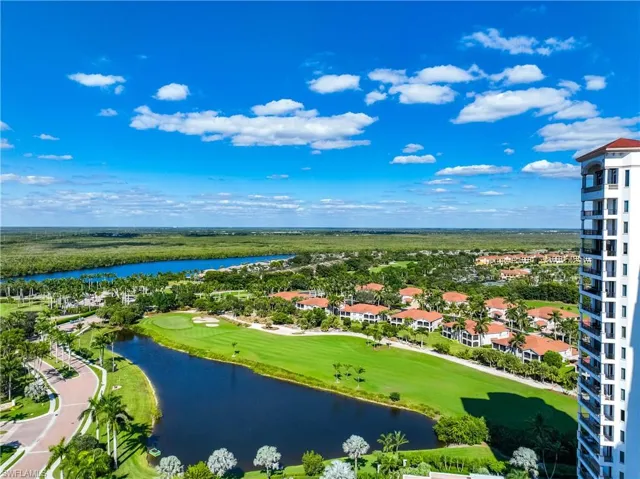 Drone / aerial view of a golf course and a large body of water