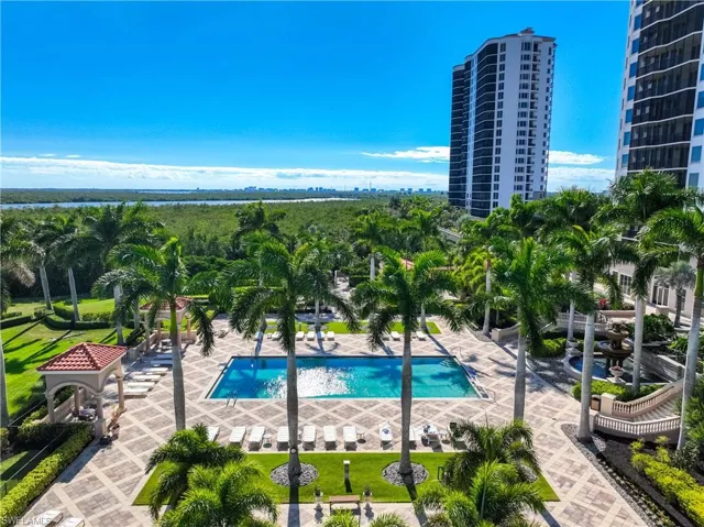 Community pool with a patio