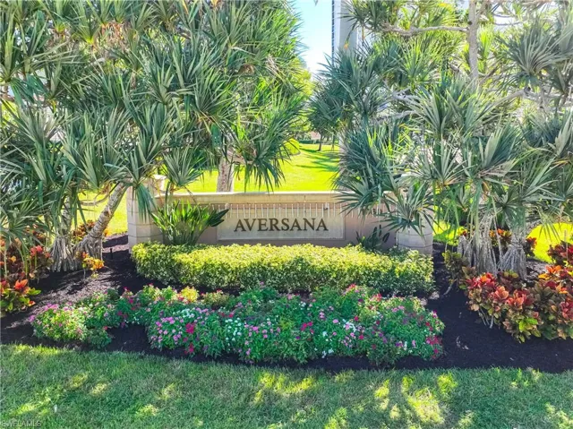 Community / neighborhood sign with a lawn