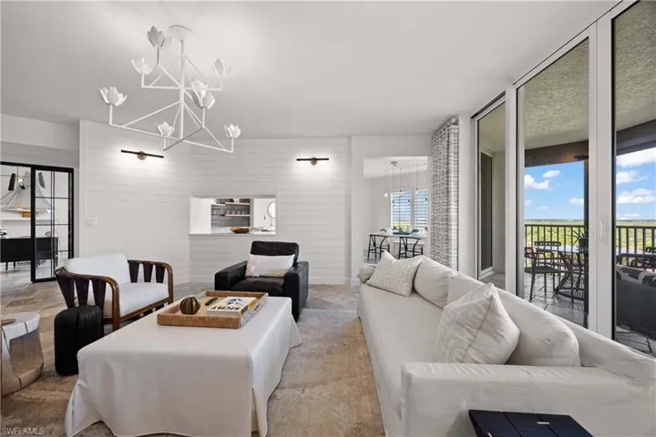 Living area with wood walls and a chandelier