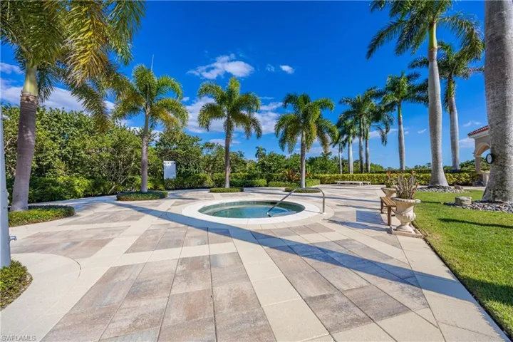 View of pool with an in-ground hot tub and a patio