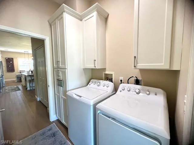 Laundry Room with Cabinetry and New Washer and Dryer.