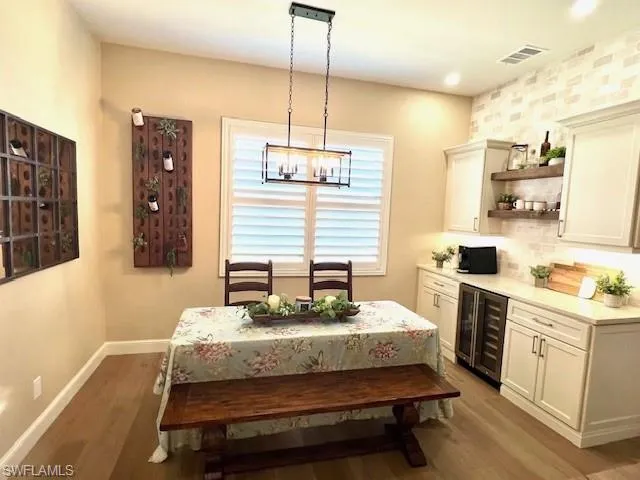 Dining with New Plantation Shutters overlooking tranquil waters.