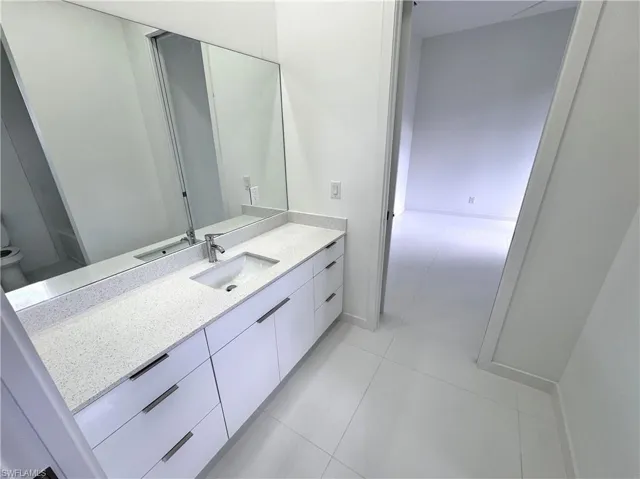 Bathroom with vanity and light tile patterned floors
