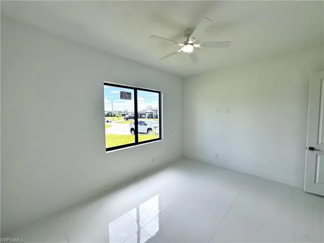 Spare room featuring a ceiling fan