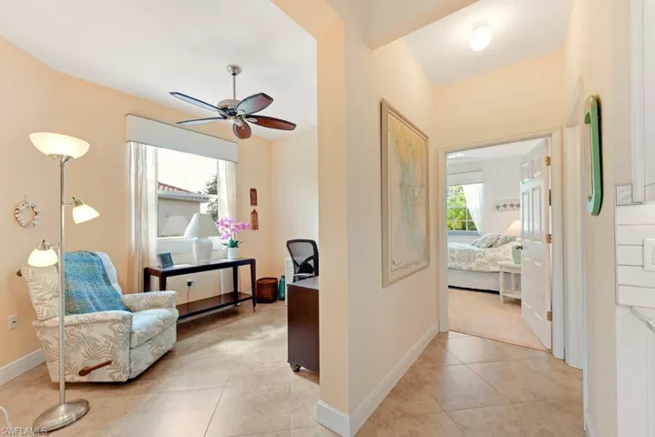 Corridor featuring light tile patterned flooring