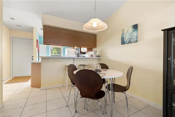 Dining room featuring light tile patterned flooring