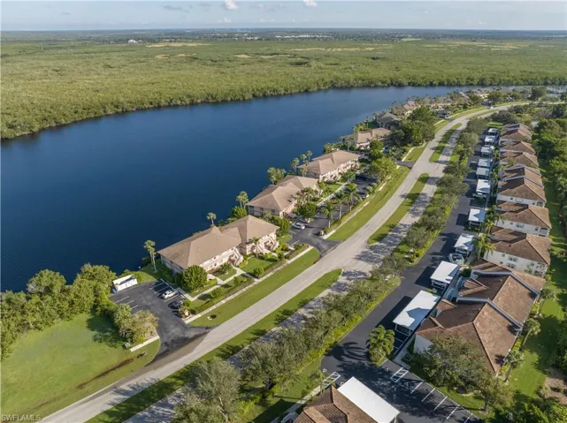 Birds eye view of property featuring a water view