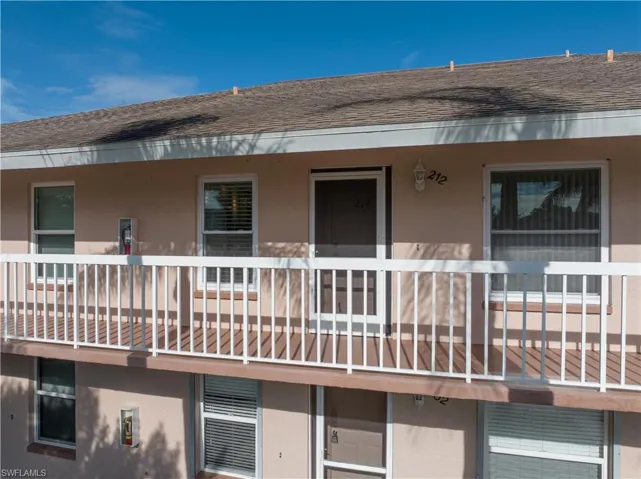 Rear view of property featuring a balcony