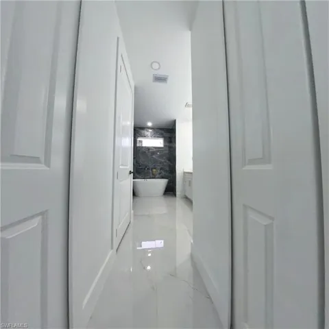 Hall featuring marble tiled flooring