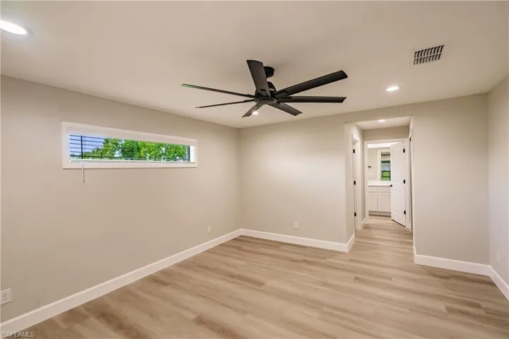 Spare room featuring light hardwood / wood-style floors and ceiling fan